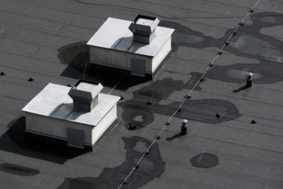 Royal Oak Flat Roof Contractor Discusses Repairs vs Replacements